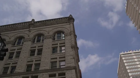 Thin clouds moving over office building time lapse Stock Footage 76942145