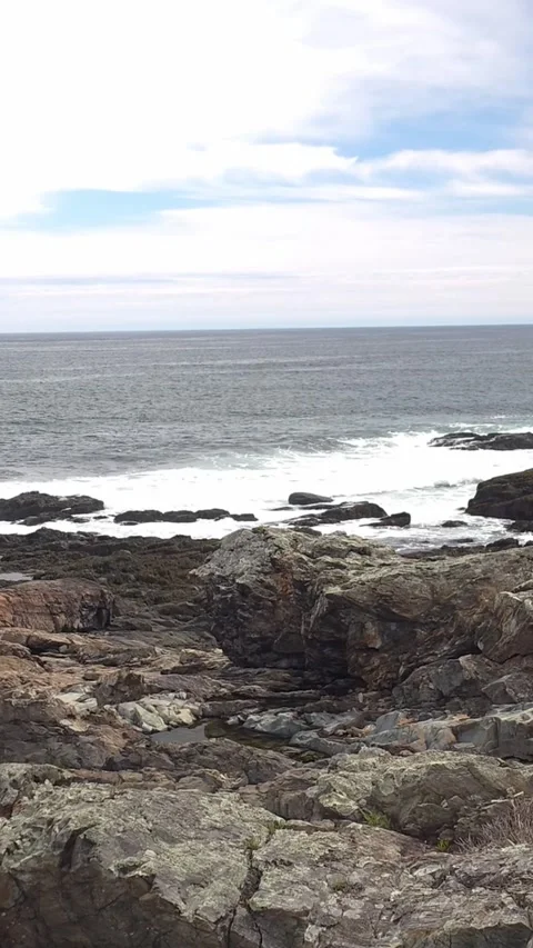 Thin clouds over rocks and ocean at Marginal Way Ogunquit, Maine Stock Footage 336532452