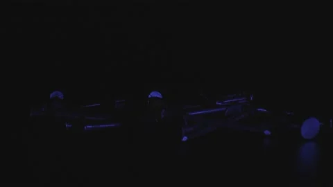 Thin construction nails in neon light in the black background. The concept of Stock Footage 159493005