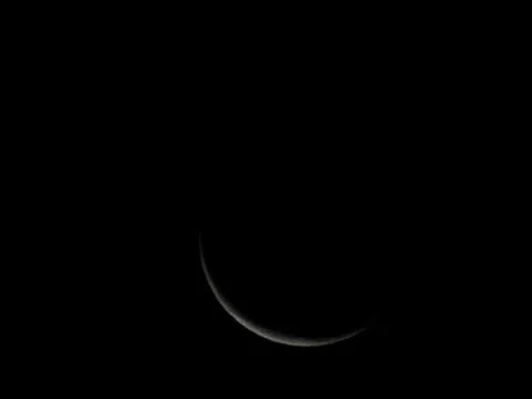 Thin crescent - the beginning of the moon. Stock Photos