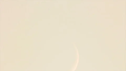 Thin crescent in bright sky Stock Footage 157864090