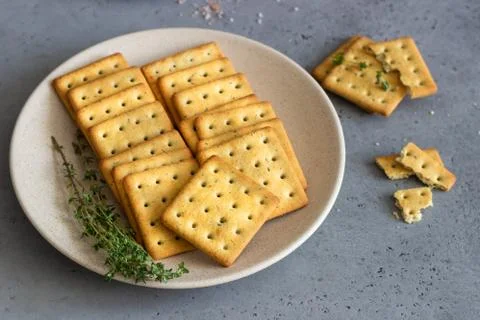 Thin crispy salted crackers with seeds and herbs. Stock Photos