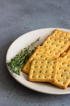 Thin crispy salted crackers with seeds and herbs. Stock Photos