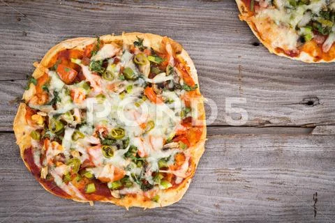 Thin crust homemade pizza Stock Photos