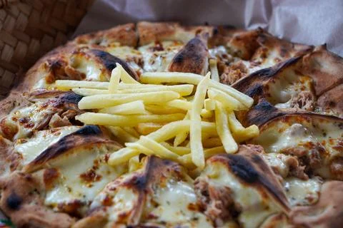 Thin-crust pizza with melted mozzarella Stock Photos