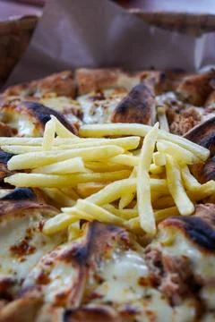 Thin-crust pizza with melted mozzarella Stock Photos