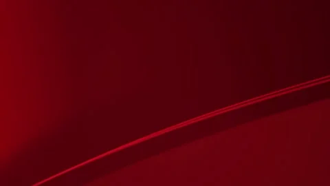 A thin diagonal line sweeps across deep crimson in a seamless loop Stock Footage 340957094