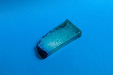 Thin flat piece of blue mint handmade soap Stock Photos