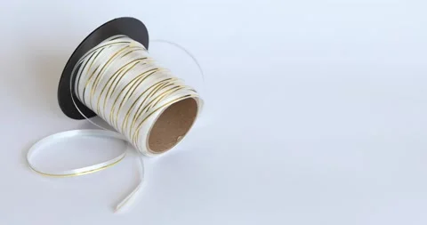 Thin gold and white packaging tape for gifts Stock Footage 141871383