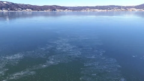 Thin Ice Patterns│Aerial Top Down│Lake Suwa Winter│4K Vídeo Stock 329063479