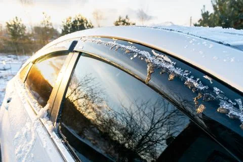 Thin layer of fresh snow ice covering cars roof in frost in morning, evenin.. Stock Photos
