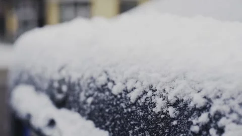 Thin layer of fresh white snow covering black car trunk in winter, close up Vídeos de archivo 134962809