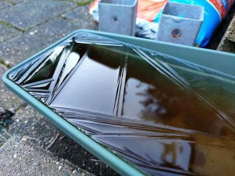 Thin layer of ice in a tray Stock Photos
