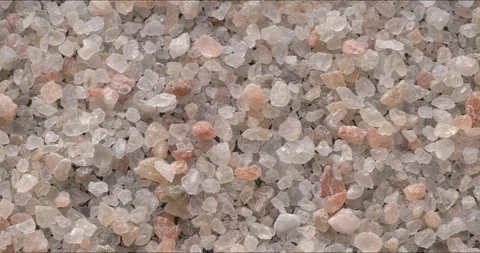 A thin layer of rock salt, scattered on a black background. Stock Footage 327814593