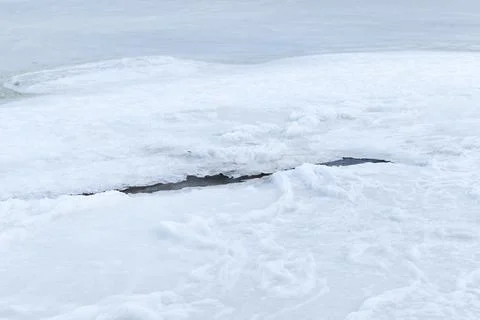 Thin layer of wet ice with polynya, abstract natural photo Stock Photos