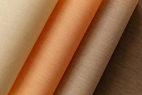 Thin linen twisted in waves in warm flesh shades, screensaver, beige background Stock Photos