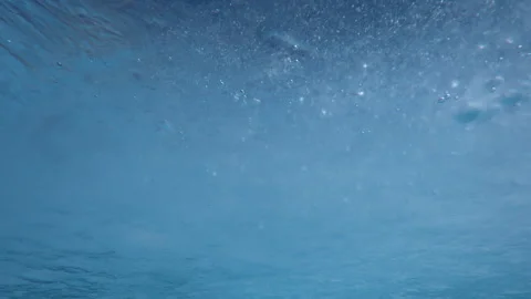 Thin melting spring translucent ice with frozen air bubbles drifting with Stock Footage 333599371