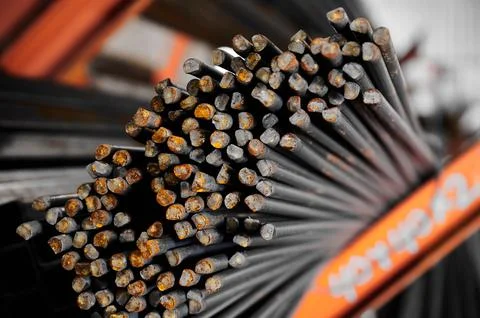 Thin metal rods bunch in cold plant warehouse macro view Stock Photos