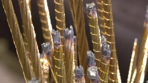 Thin metal threads are woven into a braid. Stock Footage 118044210