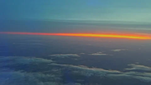 Thin Orange Horizon Beneath Wispy Clouds and Twilight Sky Stock Footage 337902015