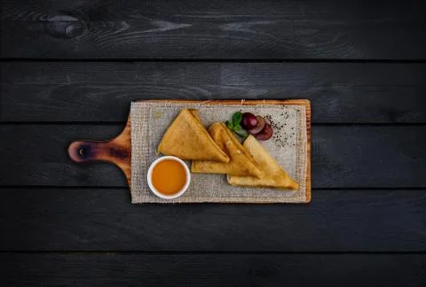 Thin pancakes or russian blini with honey leaf of mint and grapes. On a woode Stock Photos