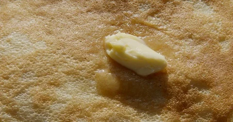 Thin pancakes stacked on plate in a pile 動画素材 127379796
