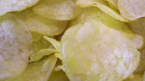 Thin Potato Chips Rotating, Irregular Shapes and Surface Texture Stock Footage 345426458