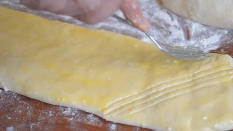 Thin puff pastry on the table Stock Footage 95943175