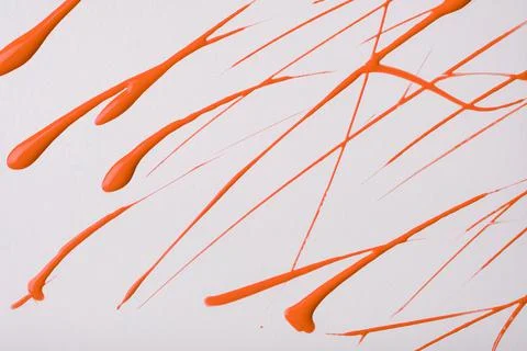 Thin red lines and splashes drawn on white background. Abstract art backdrop Stock Photos