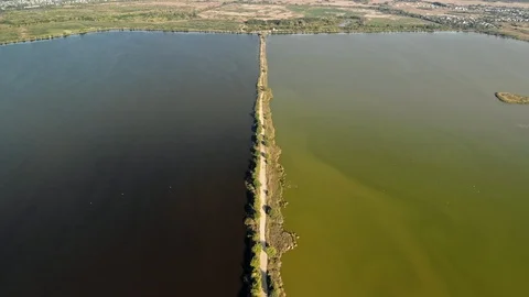 Thin road line in the middle of a lake Stock Footage 111479695