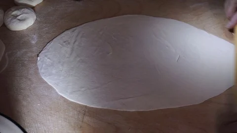 Thin rolled stiff dough for qutab Stock Footage 106198634