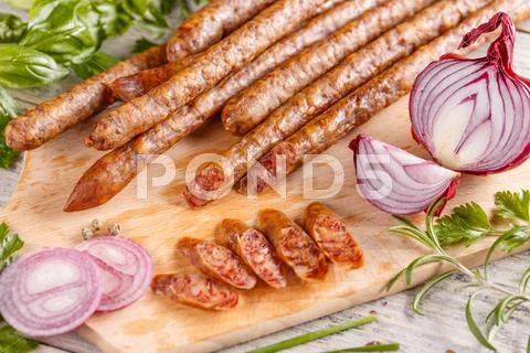 Thin salami sausages Stock Photos