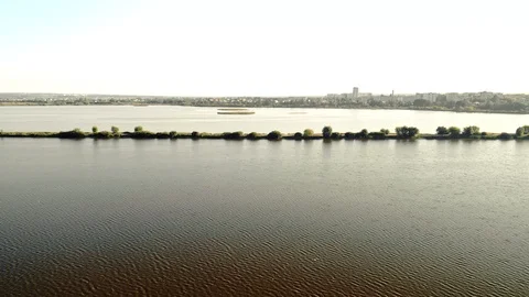 A thin sand bridge over an artificail lake Stock Footage 112490860