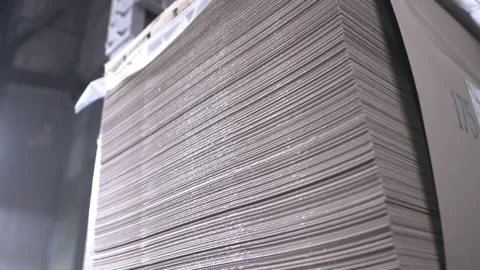 Thin sheets stack of cardboard lie in storage for loading Stock Footage 303104667