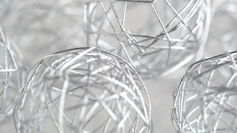 Thin silver wire, abstract background. Decorative wire spheres, rotating Stock Footage 272435376