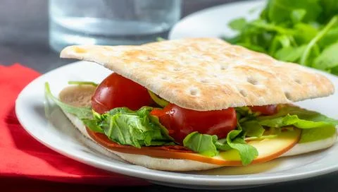 Thin slice cheese and salad sandwich on a plate Stock Photos