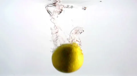 Thin Slice Of Lemon Falling Slow Motion In Clear Water Stock Footage 63252324