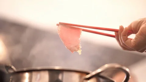 Thin sliced beef with steamed pot for shabu or suki Stock Footage 121389194