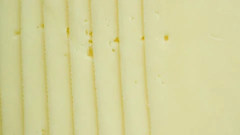 Thin sliced cheese in soft lighting a delicious background for food photogr.. 스톡 동영상 332858596