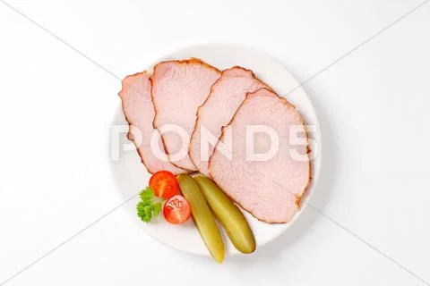 Thin sliced smoked pork meat Stock Photos
