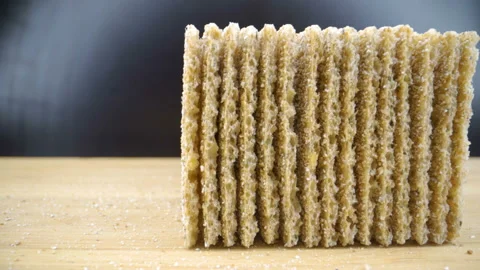 The thin slices of the bread crispies on the table Stock Footage 135694697