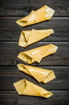 Thin slices of cheese. Stock Photos