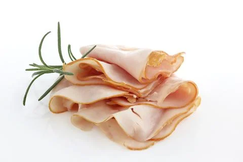 Thin slices of ham, Sliced ham with fresh rosemary herb on a white background.	 Stock Photos