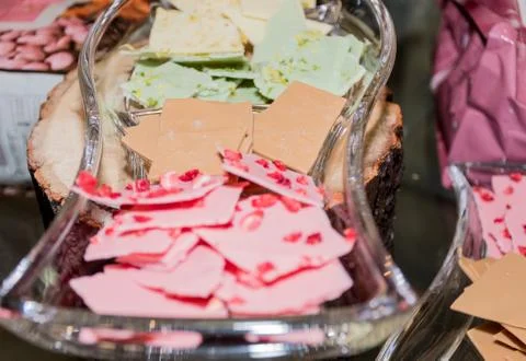 Thin slices, small pieces of colored artisan homemade chocolate Stock Photos