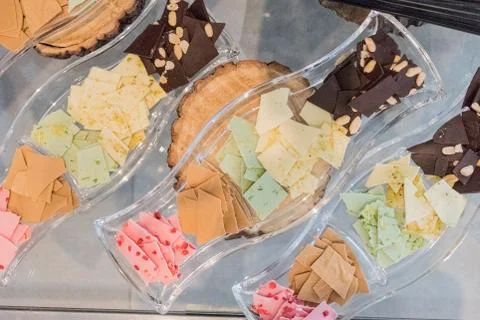 Thin slices, small pieces of colored artisan homemade chocolate Foto stock