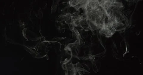 Thin spooky dark smoke over black background Stock Photos