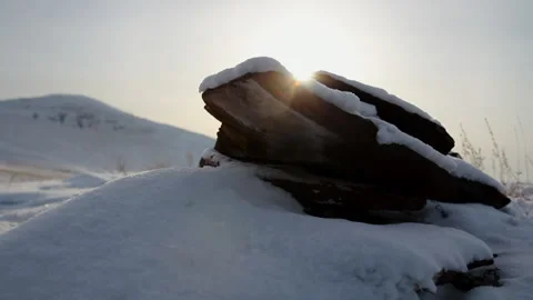 Thin Stone Disks on Ancient Tomb. Ancient Burial of Nomads in Snowy Desert Stock Footage 146947534