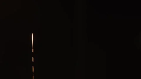 Thin stream of vegetable oil glowing on black background Vídeo Stock 335155163