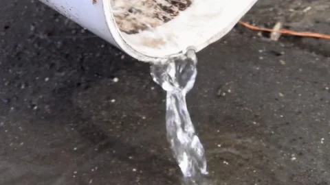 A thin stream of water pours from the drain pipe Stock Footage 148101612