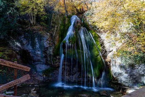 Thin streams of a mountain waterfall Stock Photos